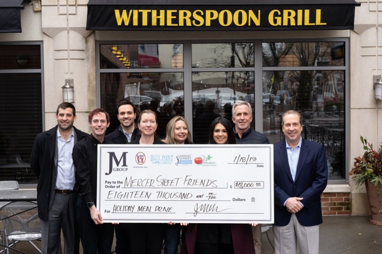 JM Group raises $18K for Mercer Street Friends Food Bank