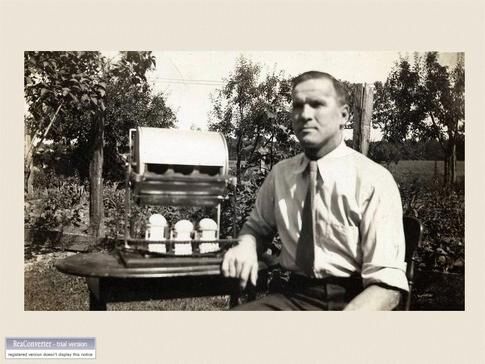 web1_Slide46-Otto-Niederer-with-original-prototype-egg-candler-and-grader-1935.jpg