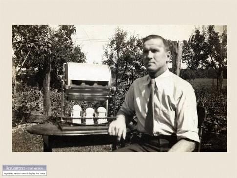 web1_Slide46-Otto-Niederer-with-original-prototype-egg-candler-and-grader-1935.jpg