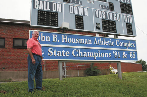 Retired football coach still savors state championships