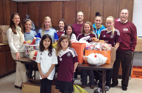 web1_2013-12-Wildcats-Thanksgiving-Donation.jpg