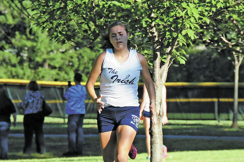 Kleks runs cross country to the beat of her own drum