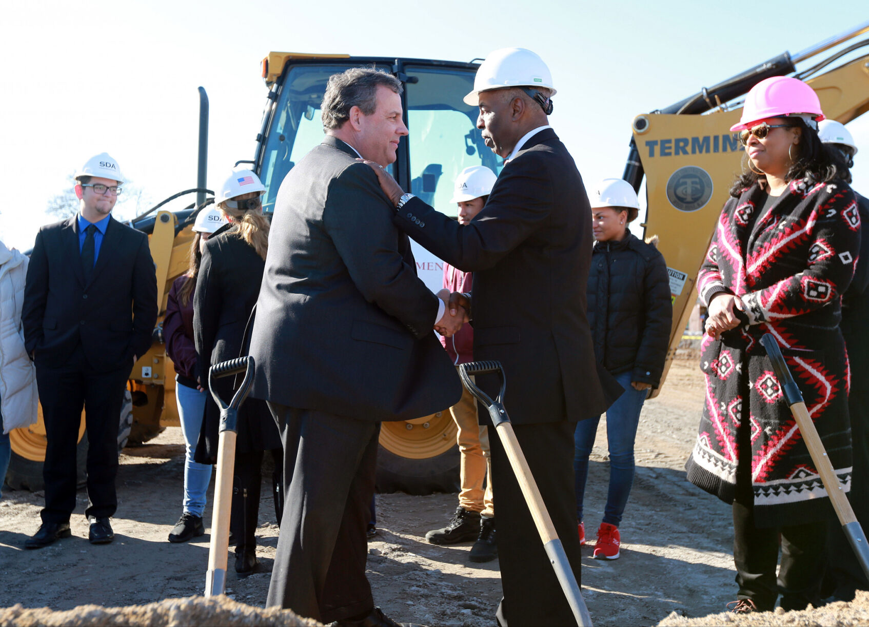 Chris Christie and Eric Jackson break ground for the construction of the new Trenton Central High School — Principal Hope Grant looks on jpg