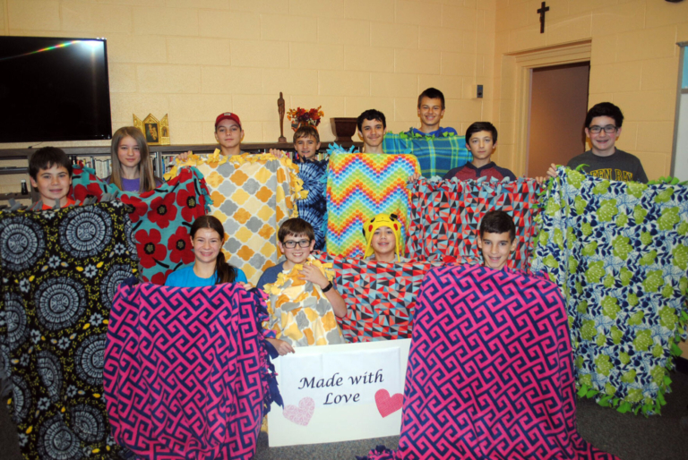 Confirmation students make blankets for cancer patients