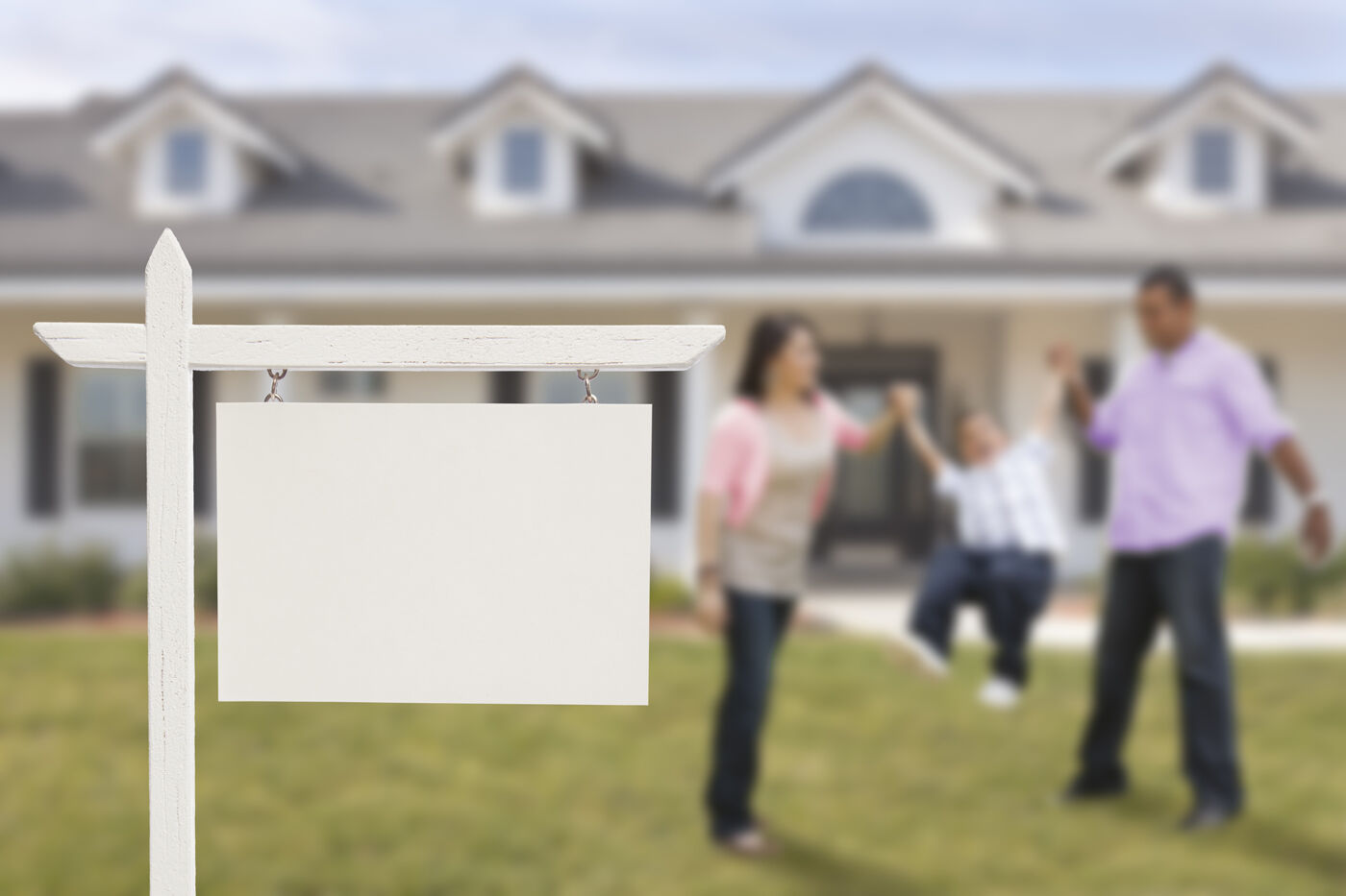 Blank Real Estate Sign and Hispanic Family at House