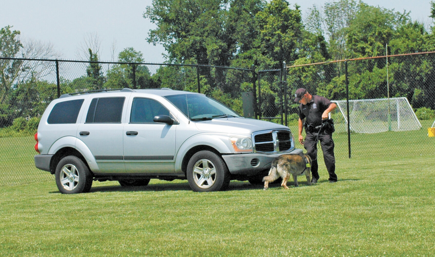Officer Drew Astbury and K-9 Joda from Trenton PD sniffing a vehicle for explosives.