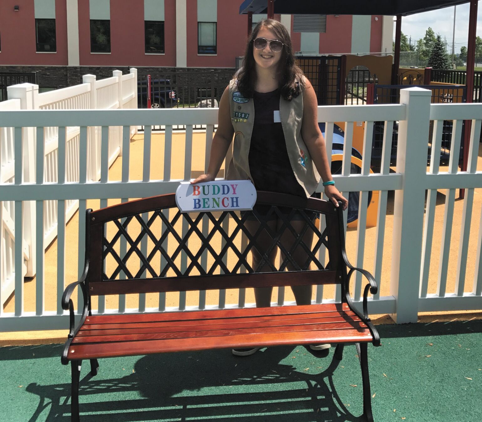 Lindsay Bizenov presenting her Buddy Bench to HomeFront