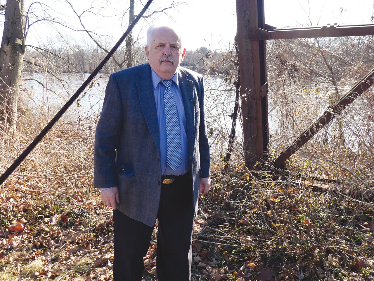 Leonard Pope at the frame that suported the cable that moved the barge to Rotary Island II