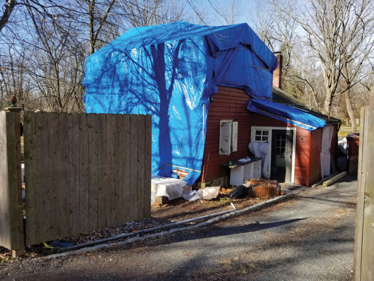 Clarke Cottage: a colorful history where blue tarp meets red tape