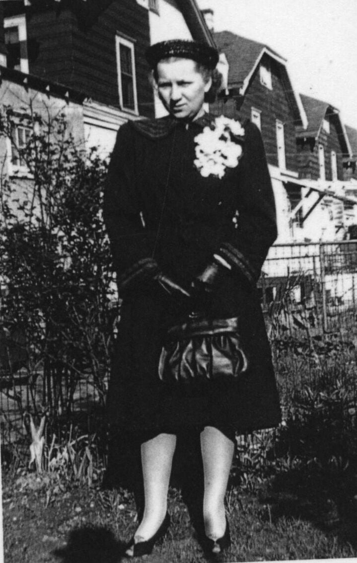 Anne Lewis in her Cavell Avenue backyard