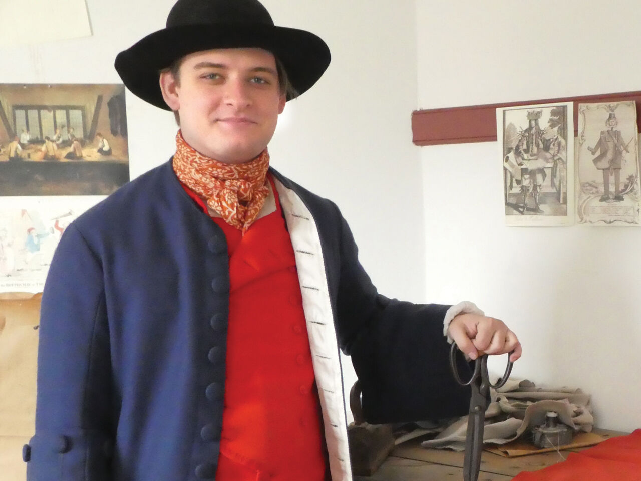 Tailor David Neiscor demonstrates the art of making Colonial era garments at the Old Barracks