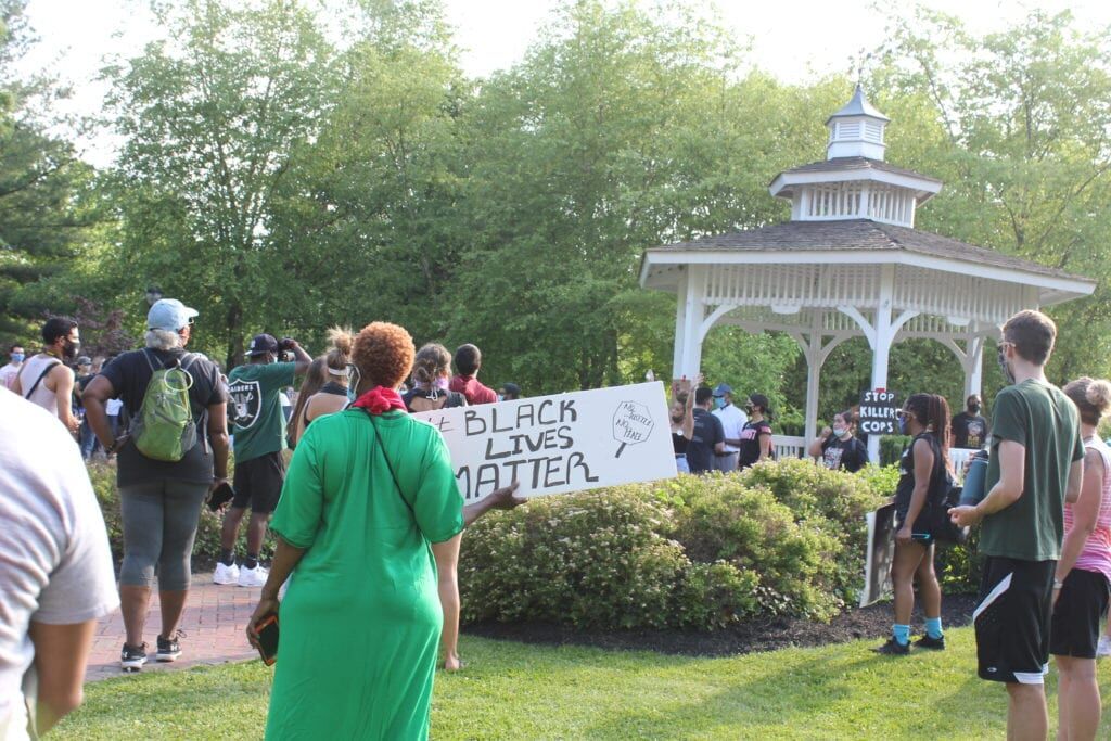 Protesters march down Route 33 at Hamilton Township rally