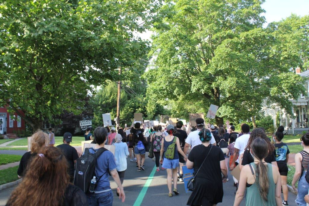 Protesters march down Route 33 at Hamilton Township rally