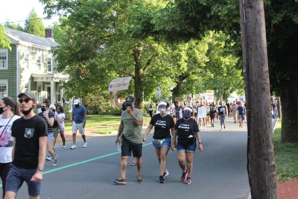 Protesters march down Route 33 at Hamilton Township rally