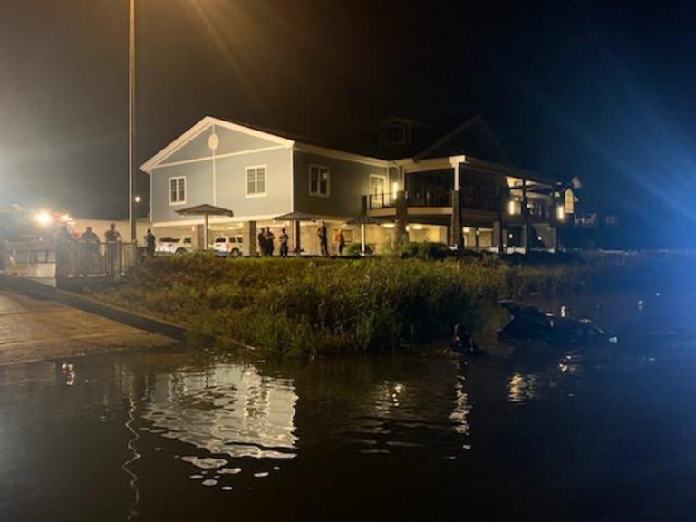 Woman drives car into Lake Mercer during heavy rainstorm