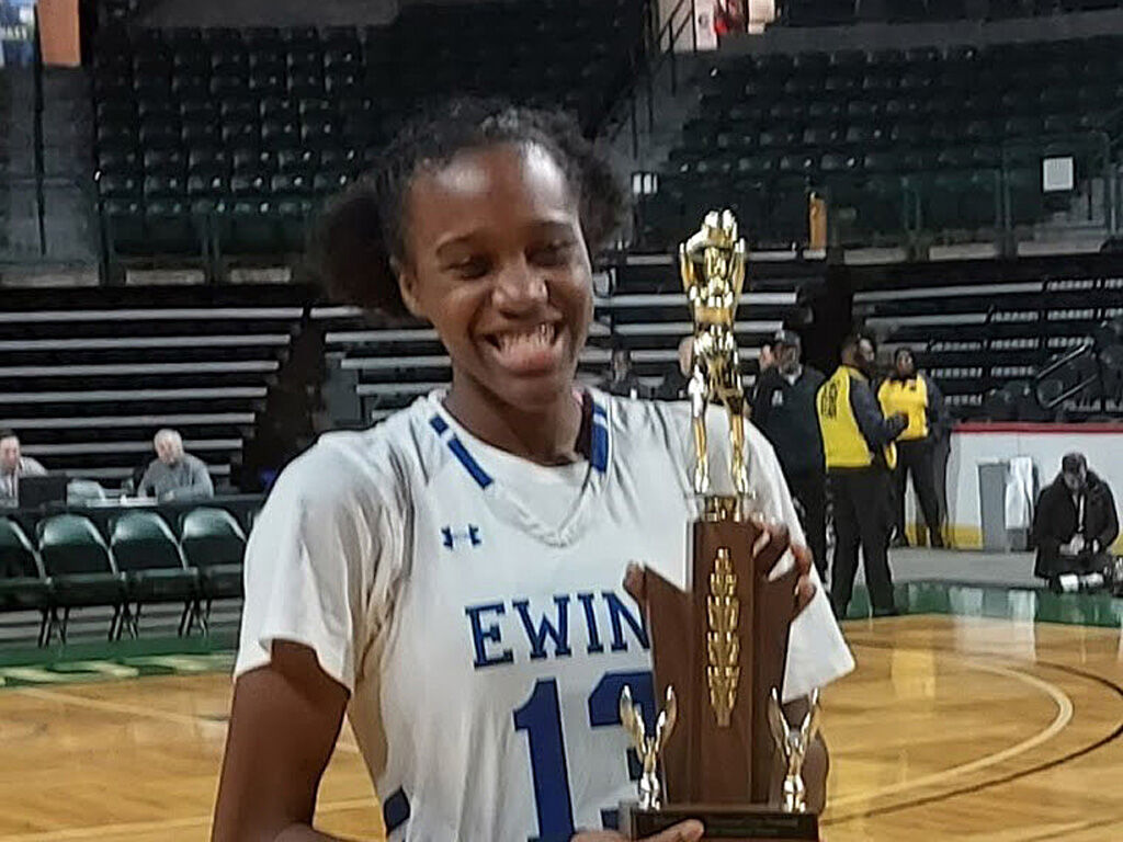 Te'Yala Delfosse holding her MVP award .jpg