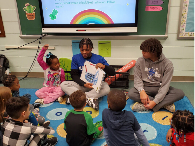 Ewing football players reach out to the community