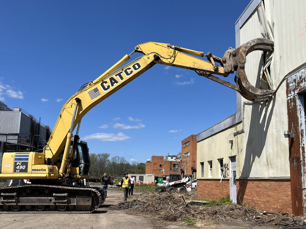 Bert Steinmann on excavator at Naval Air Warfare Center