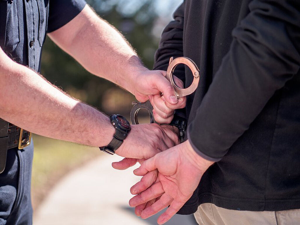 Man being arrested handcuffs