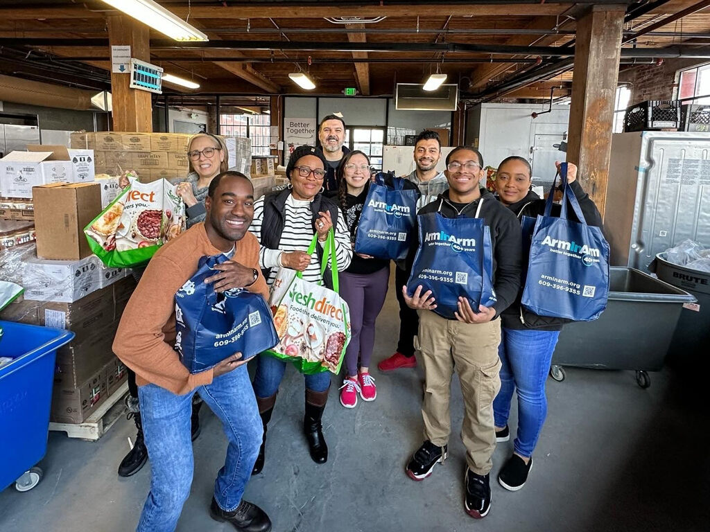 Arm in Arm--  Liquid Church group at food distribution hub at Mill One.jpg