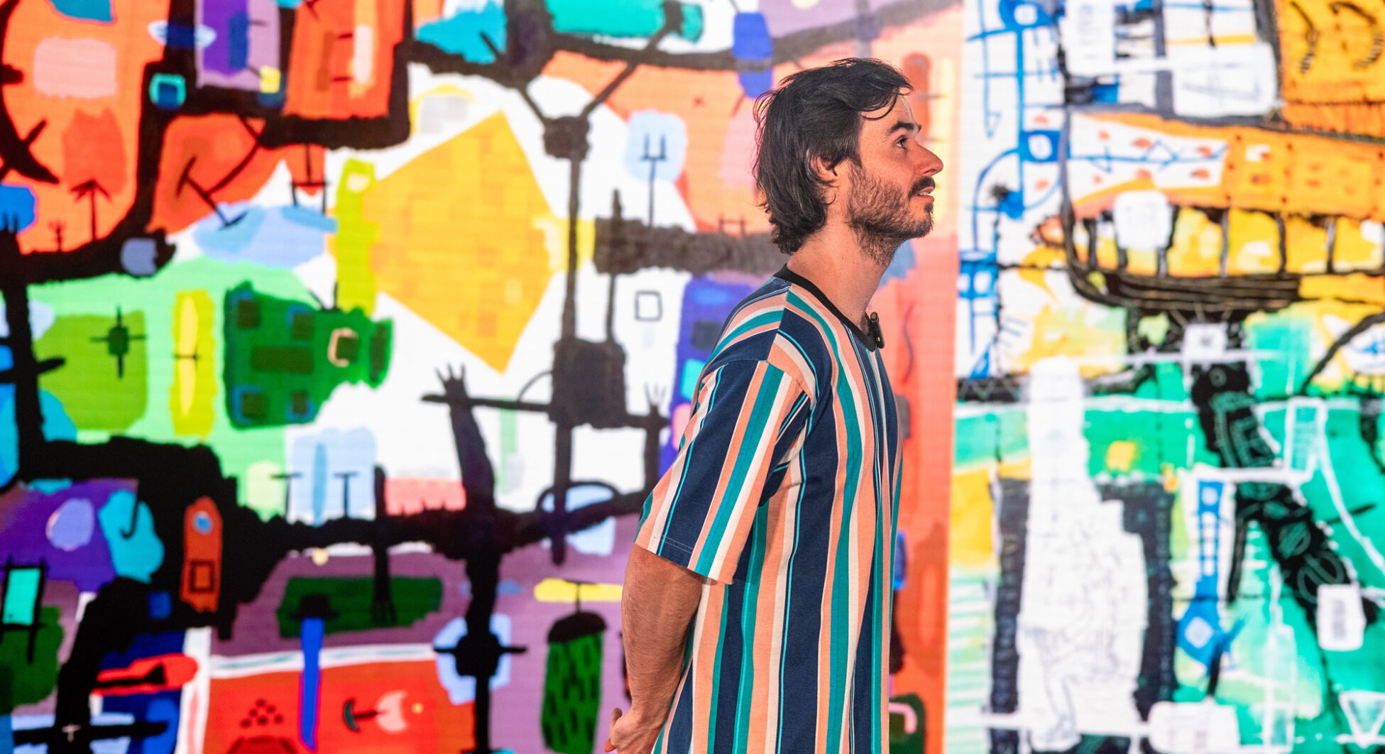 recent photo of Sam in front of his art mid show - photographer Sarah Findlay.jpg