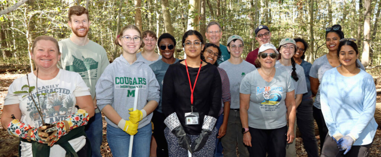 Volunteers plant native trees to bolster Curlis Woods